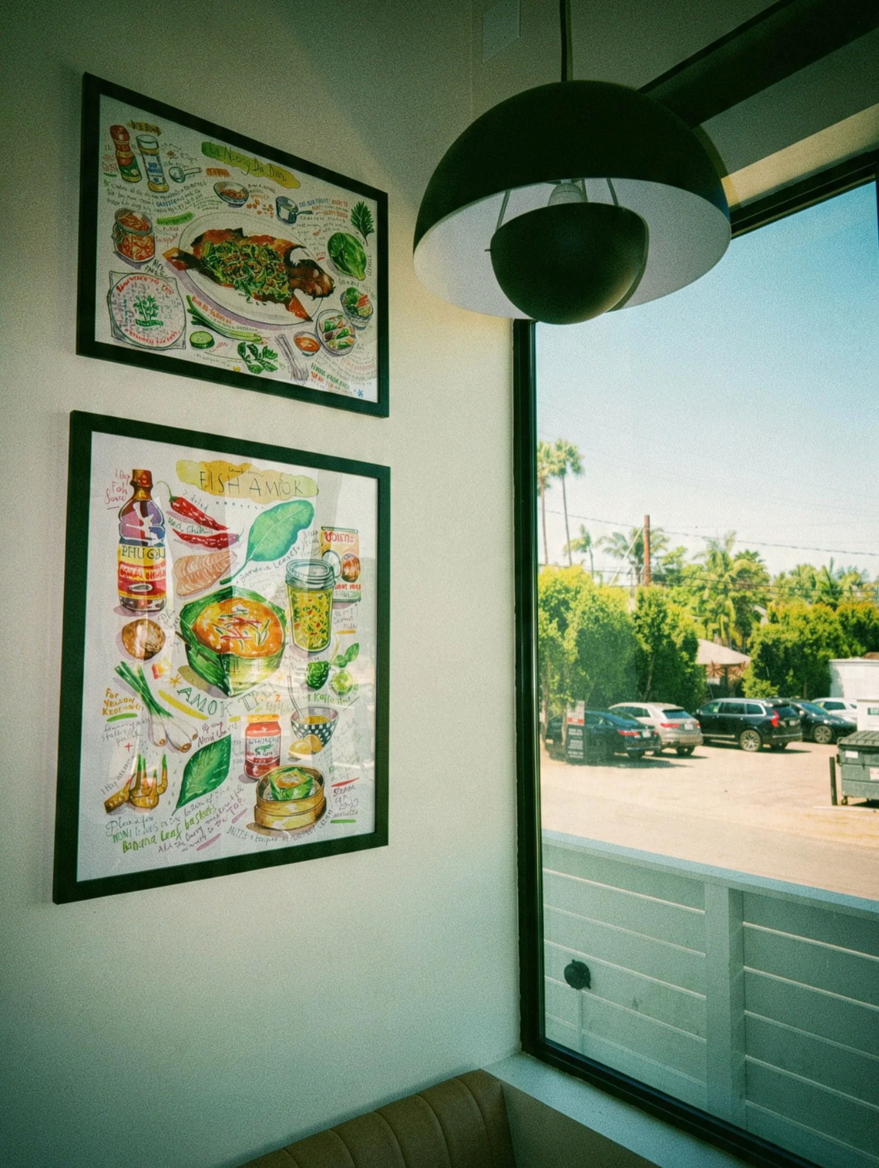 Illustrated food artwork in the sunlit Coast Thai-Way interior